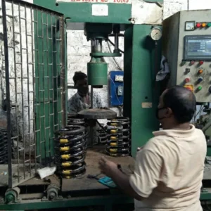 A worker working on a Spring Testing Machine