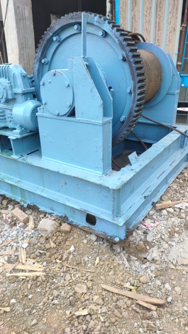 A blue colour Winch machine on the field